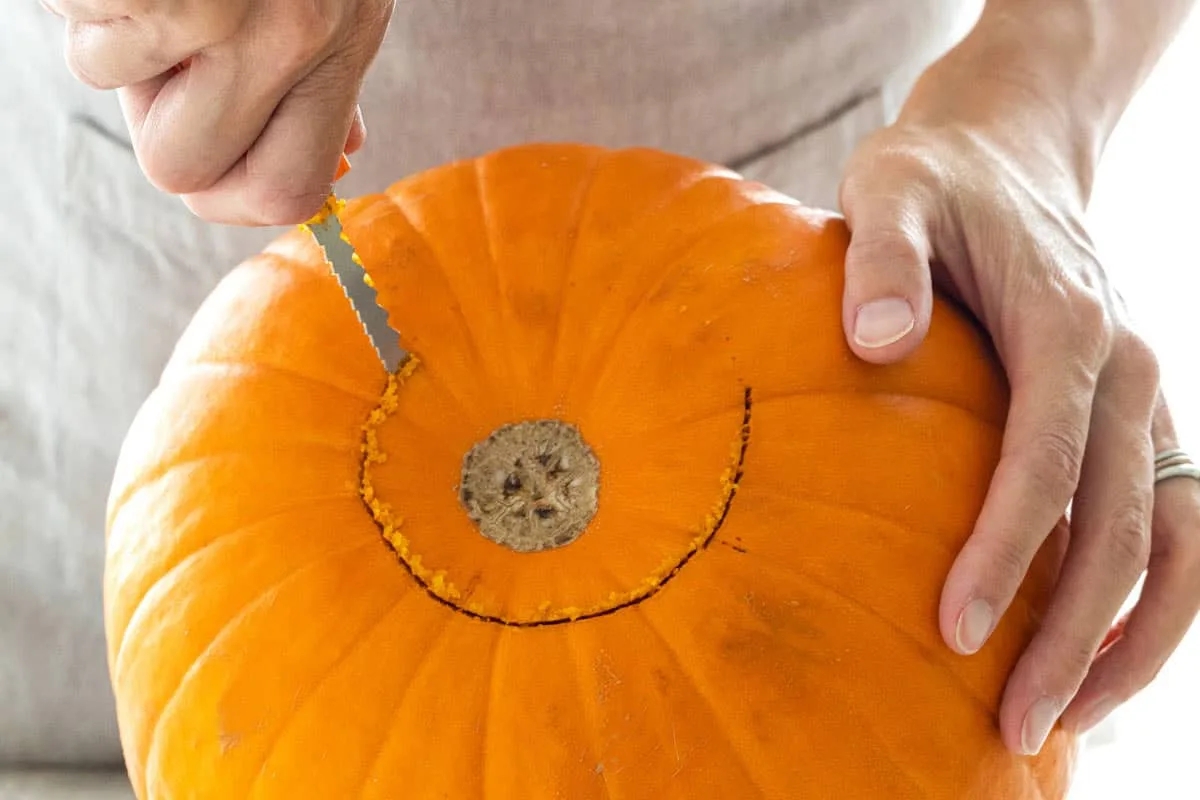 cutting pumpkin lid at angle